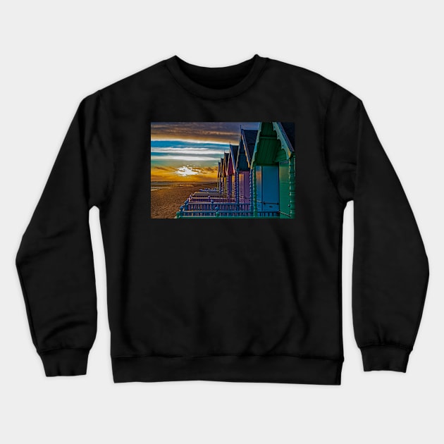 Beach huts on Mersea Island at sunset Crewneck Sweatshirt by mbangert